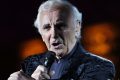 FILE - In this July 9, 2009 file photo, French singer Charles Aznavour performs during a concert at the annual Beiteddine cultural festival in the central Chouf mountains east of Beirut, Lebanon. Charles Aznavour, the French crooner and actor whose performing career spanned eight decades, has died. He was 94. (AP Photo/Bilal Hussein, File)