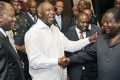 Former Ivory Coast Prime Minister Alassane Dramane Ouattara (L) of the Gathering of the Republican party poviews  Ivory Coast president Laurent Gbagbo (C) shaking hands with Ivory Coast former President Henri Konan Bedie during a meeting held at the presidential palace in Abidjan on June 30,2010. Elections have been postponed seven times since Gbagbo's mandate ran out in 2005, the latest delay coming in February when the head of state scrapped both the government and the Independent Electoral Commission. Second row, second R Ivory Coast Prime minister Guillaume Soro.      AFP PHOTO/ SIA KAMBOU