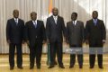 Yamoussoukro, IVORY COAST:  (L to R) Ivory Coast ' rebel leader Alassane Ouattara, interim Prime Minister Charles Konan Banny, President Laurent Gbagbo, former president Henri Konan Bedie, and rebel leader of the New Forces party  Guillaume Soro are pictured before the release of the final communique after their talks held at the Felix Houphouete Boigny Fundation in Yamoussoukro, 28 February 2006, to seek ways for a peace process. It is the first such gathering to have been organised without international mediation and and the first since 2002 to be held on Ivorian soil.    AFP     PHOTO       KAMBOU SIA  (Photo credit should read KAMBOU SIA/AFP/Getty Images)